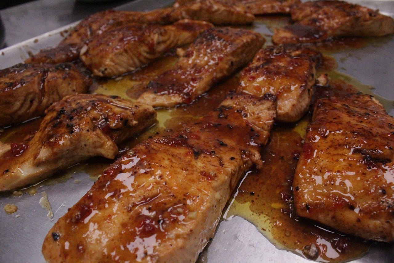Glazed salmon fillets on a tray